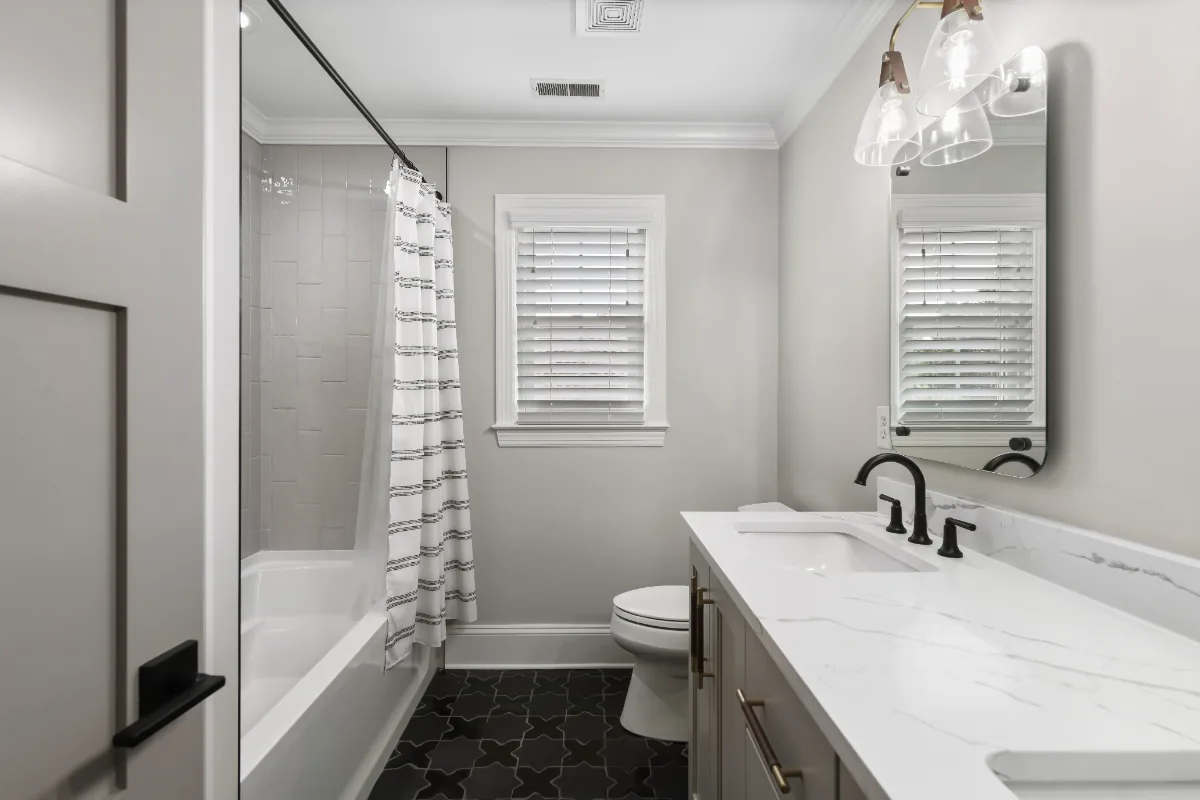 A modern-elegant whole house remodel in Watkins Creek, Franklin TN 37067. Nine spaces transformed with White Oak cabinetry, Mikado quartz, and Honey Bronze hardware by Sebring Design Build.