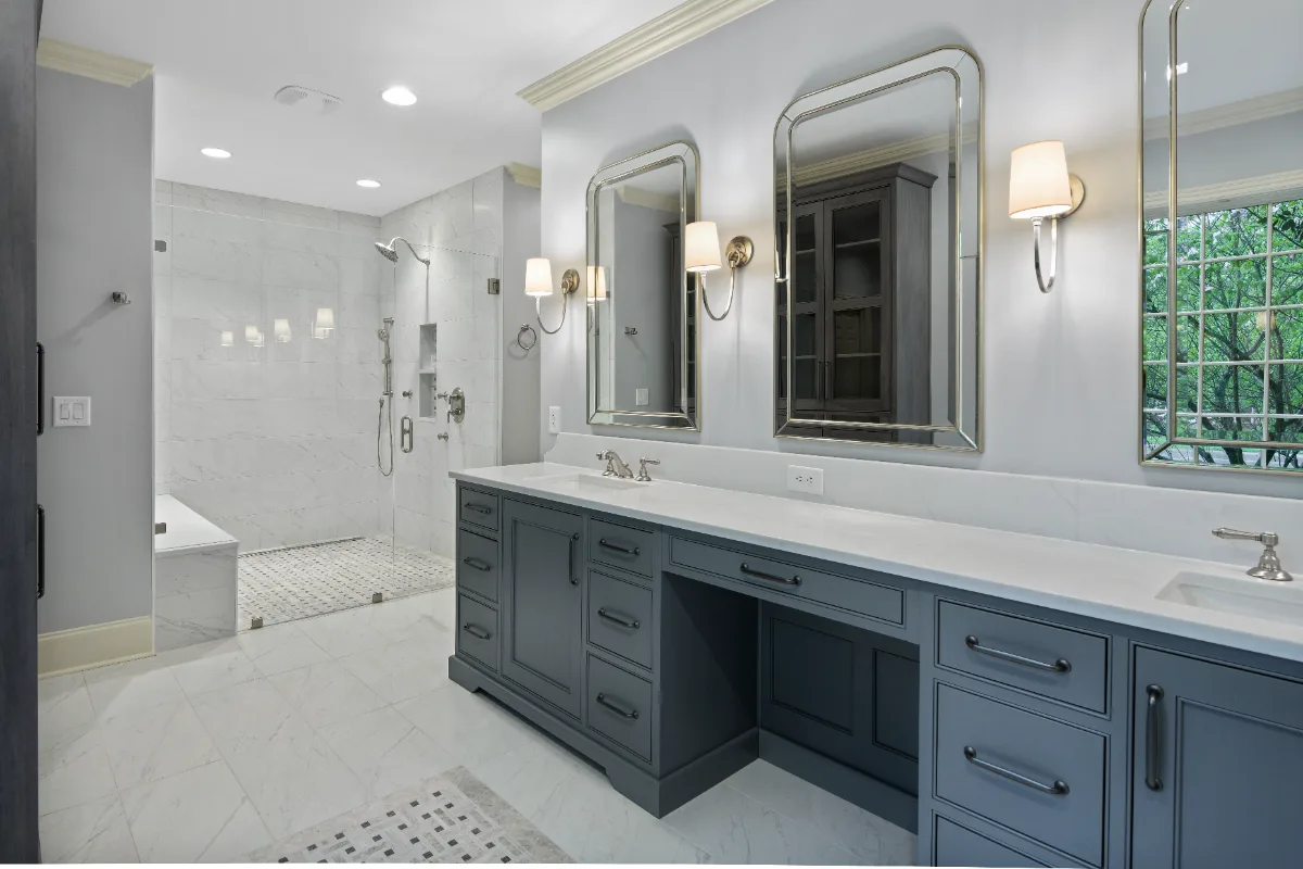 A classic-transitional primary bath remodel in Bonbrook, Brentwood TN 37027. Beaded inset cabinetry, Cambria Ella quartz, Daltile Diamond Carrara, and Rohl Satin Nickel fixtures by Sebring Design Build.