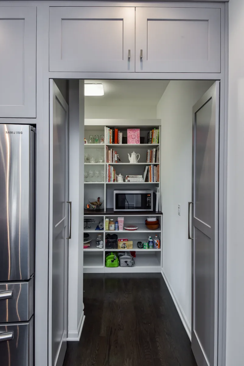 A Franklin, TN kitchen and pantry remodel with metropolitan style and two-tone cabinetry. Functional, balanced design by Sebring Design Build.