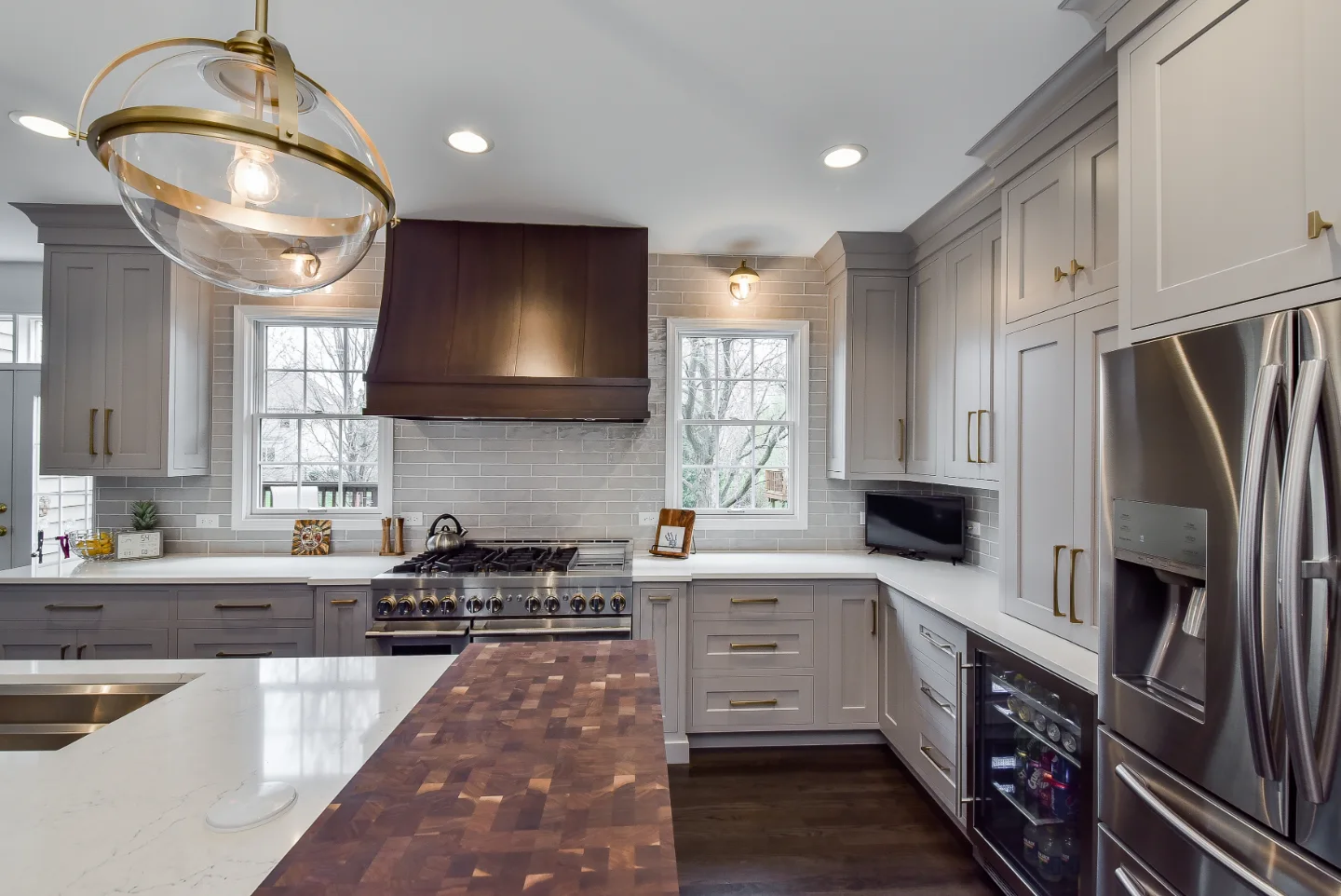 A Franklin, TN kitchen and pantry remodel with metropolitan style and two-tone cabinetry. Functional, balanced design by Sebring Design Build.