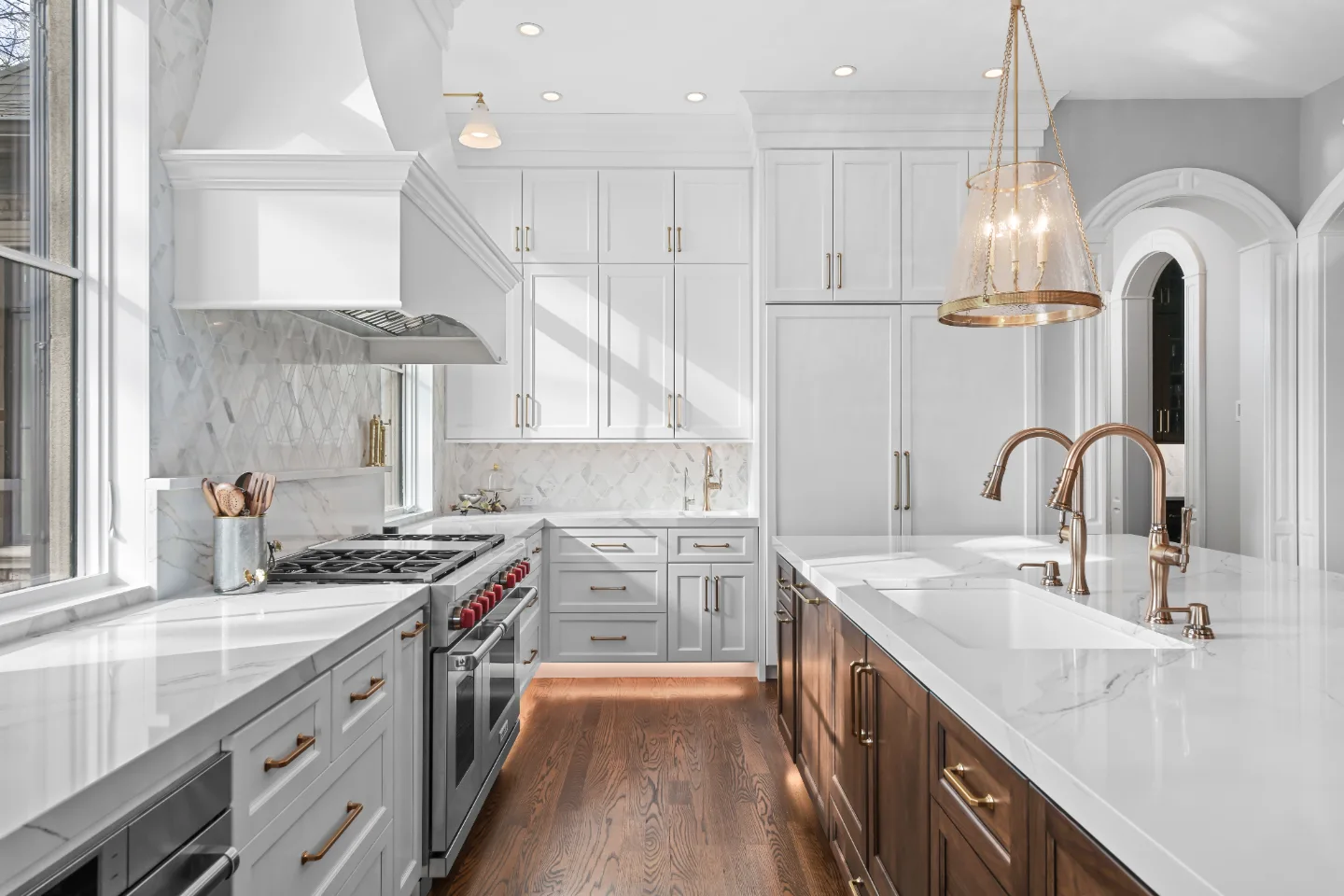 A Governors Club kitchen remodel in Brentwood, TN with an elegant, light palette. Custom cabinetry and refined finishes by Sebring Design Build.