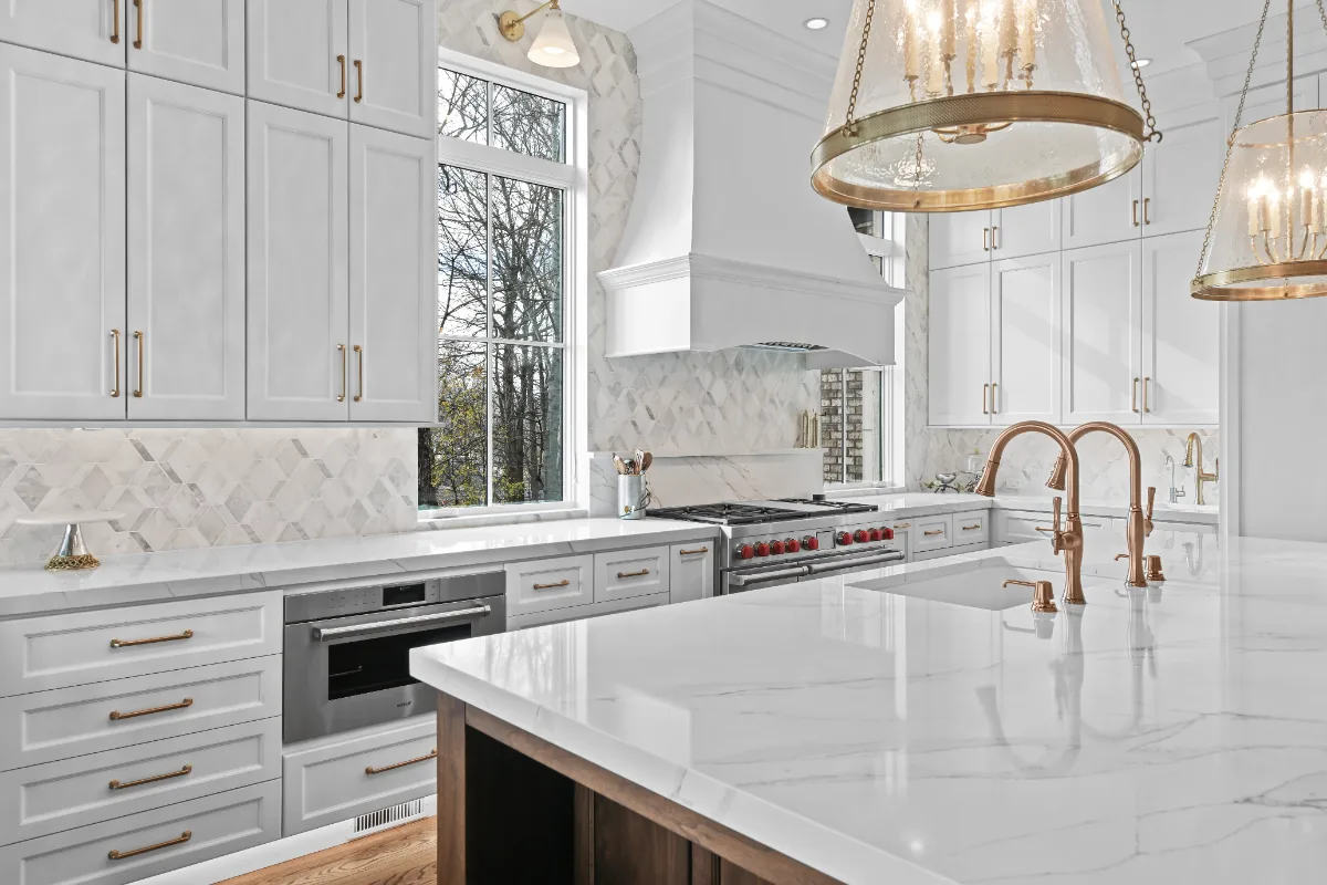 A Governors Club kitchen remodel in Brentwood, TN with an elegant, light palette. Custom cabinetry and refined finishes by Sebring Design Build.
