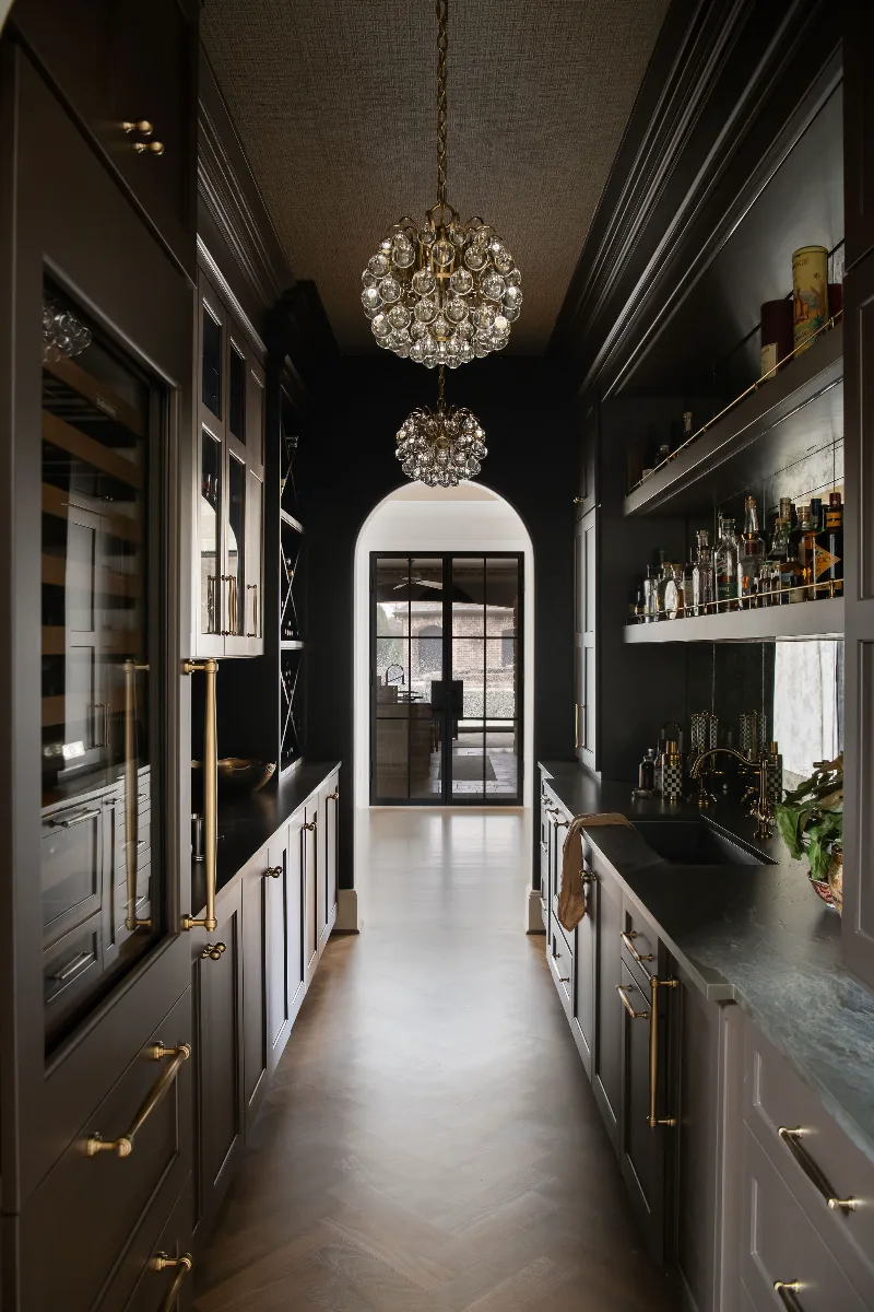 A complete kitchen, butler pantry, bar, and powder room remodel in McGavock Farms, Brentwood. Custom cabinetry, Calacatta quartz, and brass fixtures by Sebring Design Build.