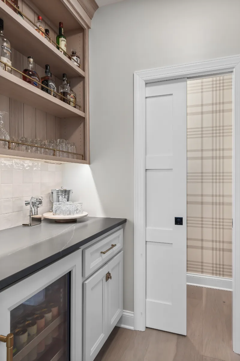 Kitchen remodel in Columbia, TN. Sebring Design Build transformed this Columbia, Tennessee kitchen with a transitional-bold design: perimeter cabinetry in Paint Grade Stone, tall cabinets in Bunker Hill Black.