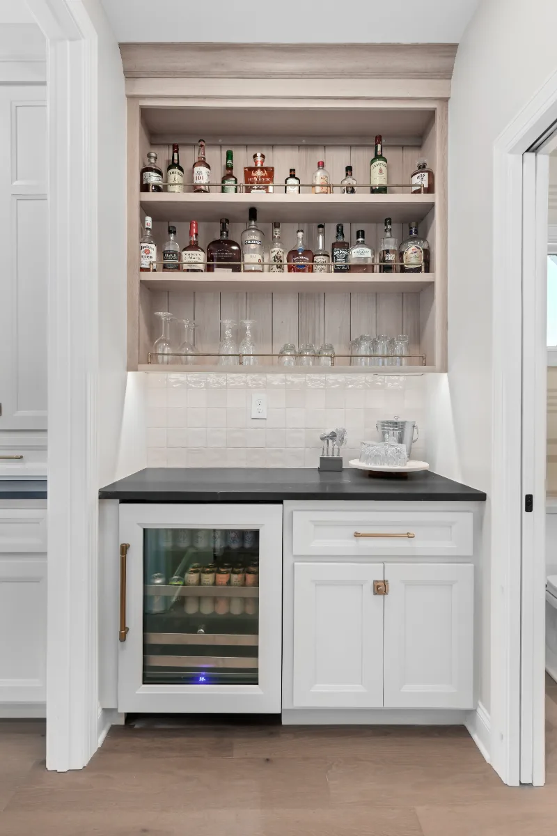 Kitchen remodel in Columbia, TN. Sebring Design Build transformed this Columbia, Tennessee kitchen with a transitional-bold design: perimeter cabinetry in Paint Grade Stone, tall cabinets in Bunker Hill Black.