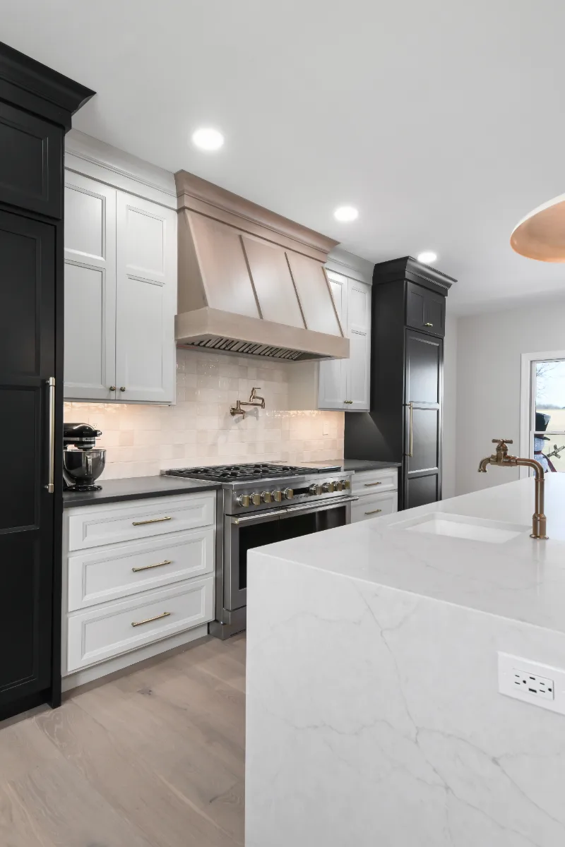 Kitchen remodel in Columbia, TN. Sebring Design Build transformed this Columbia, Tennessee kitchen with a transitional-bold design: perimeter cabinetry in Paint Grade Stone, tall cabinets in Bunker Hill Black.