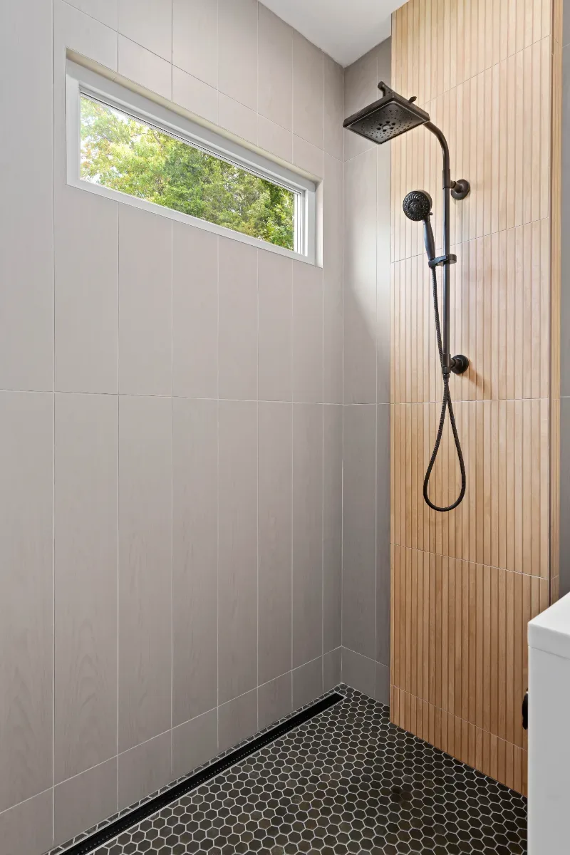 Primary Bath remodel in Westhaven, TN. Sebring Design Build transformed this Westhaven primary bath in Franklin, Tennessee with CWP Notable Slab Marion Gray cabinetry, polished quartz countertops.
