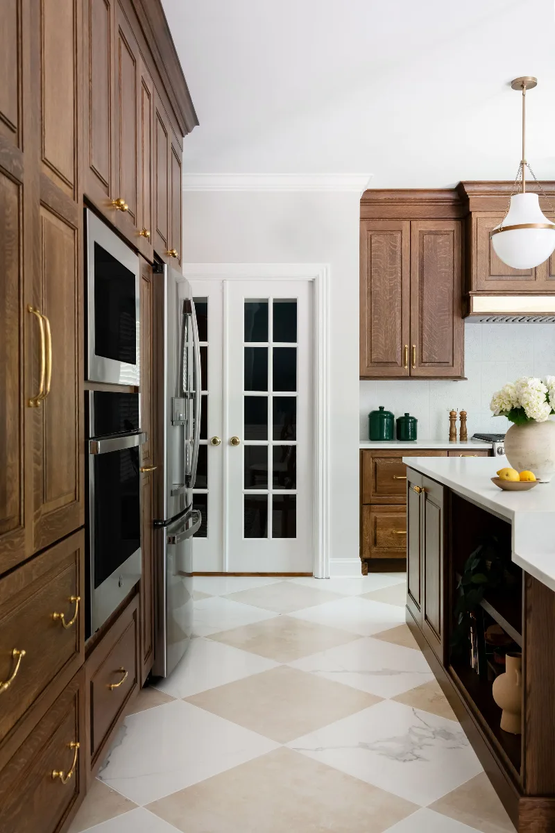 Kitchen remodel in Chenoweth, TN. Sebring Design Build transformed this Chenoweth kitchen in Brentwood, Tennessee with CWP Classic Square Raised Solid Wood Panel White Oak Coffee Marginal Overlay cabinetry.