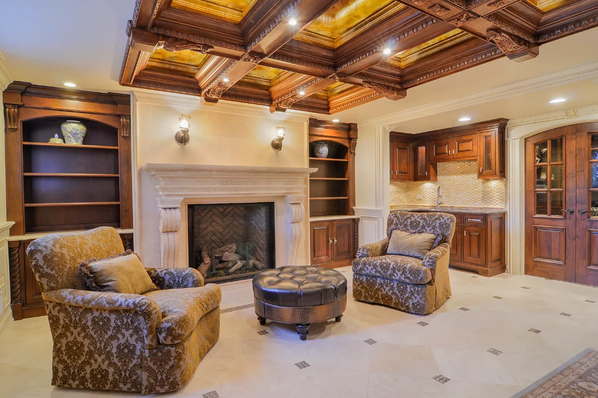 Living Room remodel in Franklin, TN. Sebring Design Build designed this Franklin, Tennessee basement living room as part of a traditional-intricate basement remodel featuring coffered ceilings, custom built-ins.