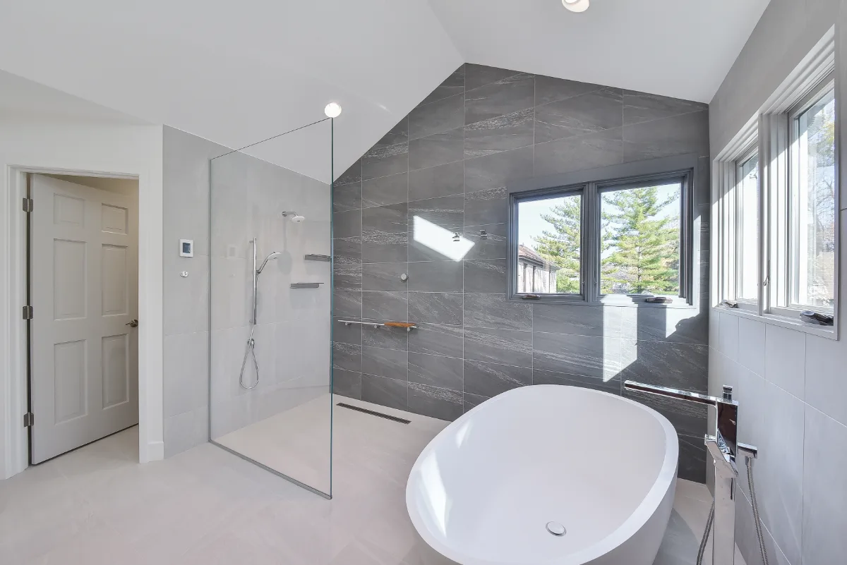 Primary Bath remodel in Franklin, TN. Sebring Design Build transformed this Franklin, Tennessee primary bath with CWP Full Overlay Walnut Ginger Slab cabinetry, CaesarStone Primordia quartz, Delta Pivotal Polished Chrome faucet.