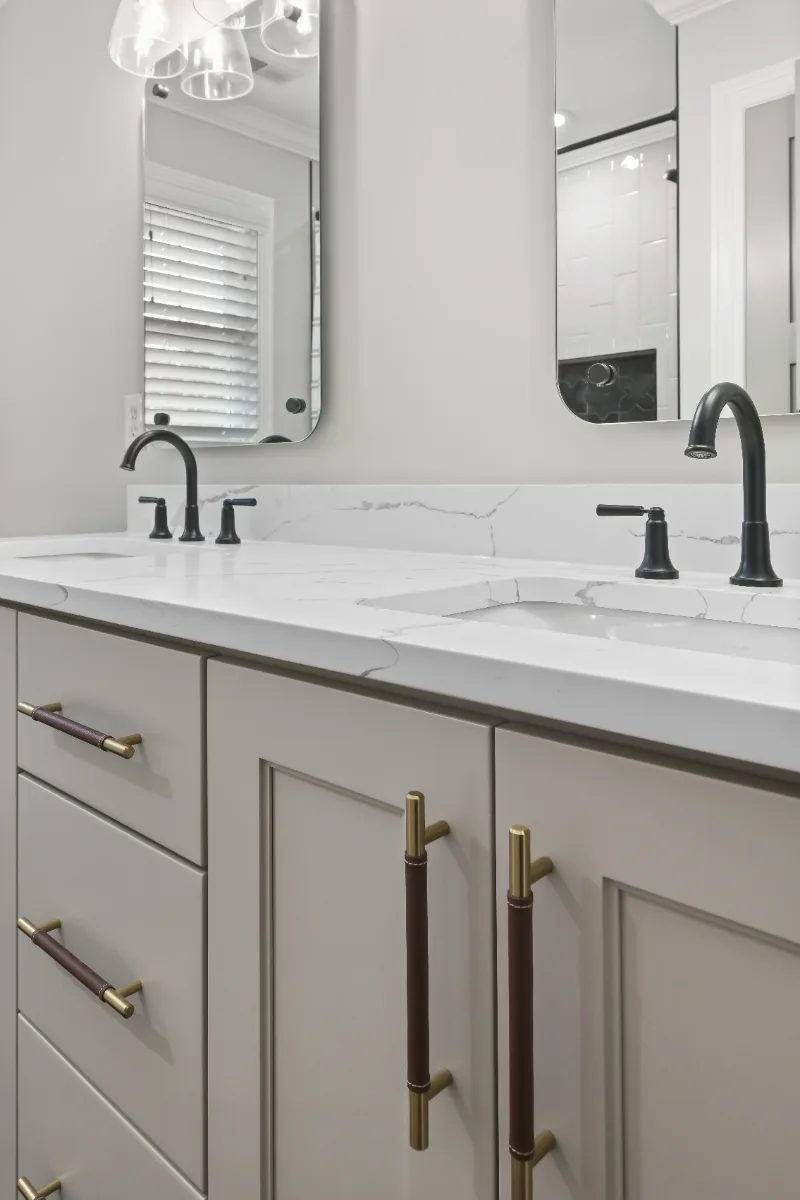 Guest Bath remodel in Watkins Creek, TN. Sebring Design Build designed this Watkins Creek guest bath (HIS) in Franklin, Tennessee with paint-grade Dune cabinetry, Mikado Calacatta Tree quartz.