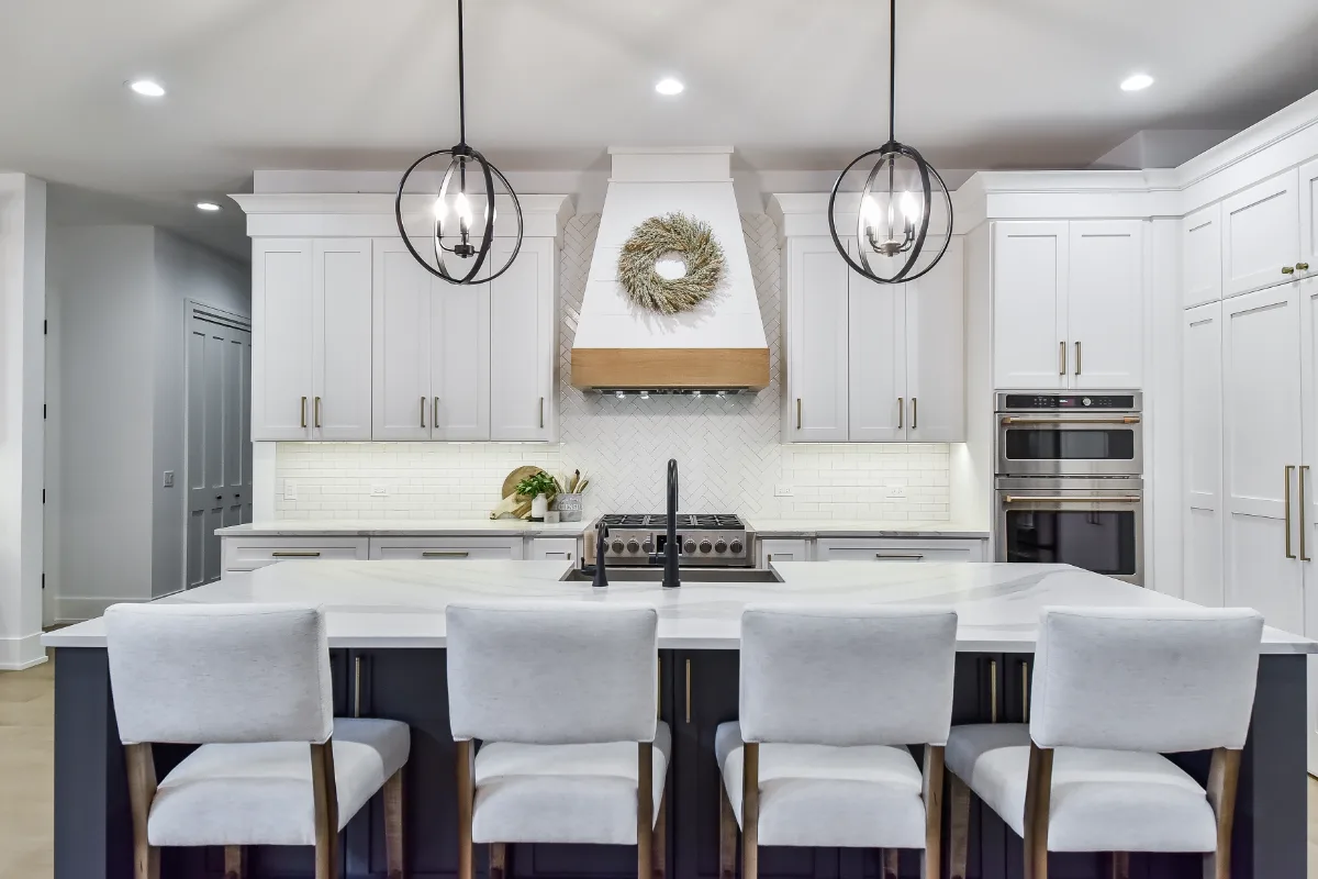 A transitional-elegant whole-home remodel in Franklin, TN. White Oak cabinetry in Sage, Cambria Brittanicca Warm quartz, and Delta Matte Black fixtures by Sebring Design Build.