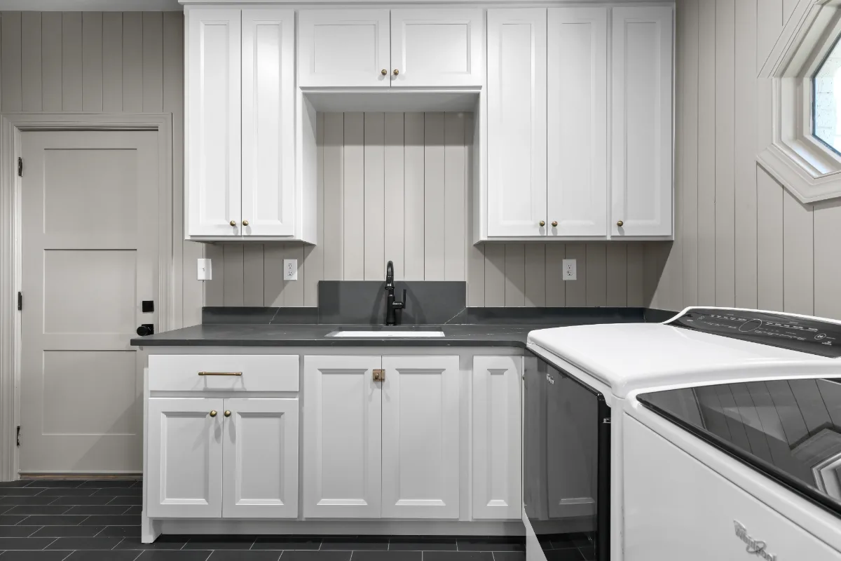 Laundry remodel in Columbia, TN. Sebring Design Build transformed this Columbia, Tennessee laundry room from a utility space into a fully designed room with Paint Grade Stone cabinetry.