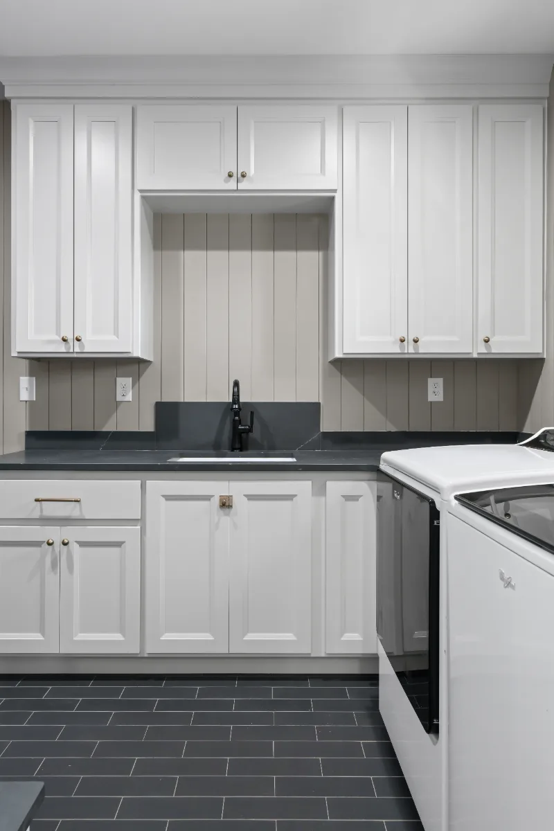 Laundry remodel in Columbia, TN. Sebring Design Build transformed this Columbia, Tennessee laundry room from a utility space into a fully designed room with Paint Grade Stone cabinetry.