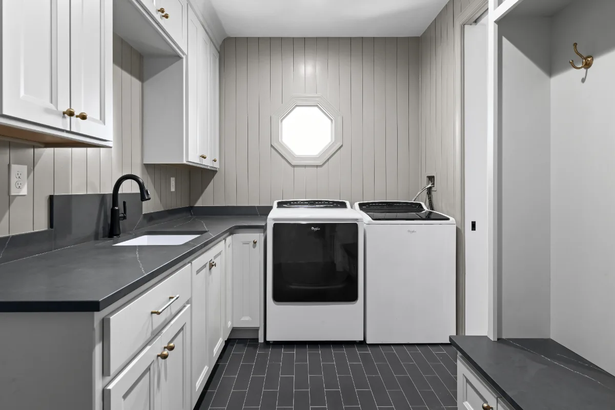 Laundry remodel in Columbia, TN. Sebring Design Build transformed this Columbia, Tennessee laundry room from a utility space into a fully designed room with Paint Grade Stone cabinetry.