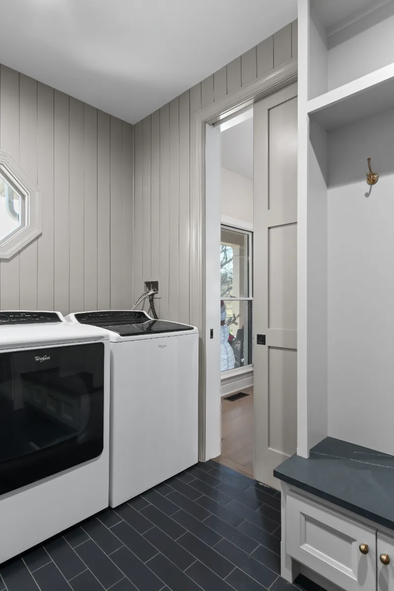 Laundry remodel in Columbia, TN. Sebring Design Build transformed this Columbia, Tennessee laundry room from a utility space into a fully designed room with Paint Grade Stone cabinetry.