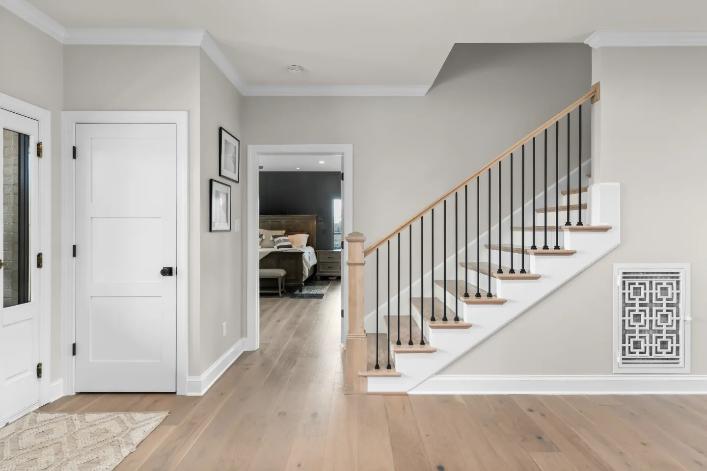 A transitional-bold whole-home remodel in Columbia, TN. White Oak cabinetry, Q-Quartz surfaces, and Delta Champagne Bronze fixtures by Sebring Design Build.