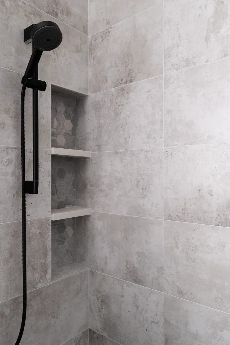 Guest Bath remodel in Franklin, TN. Sebring Design Build designed this Westhaven guest bath in Franklin, Tennessee with Alder Nutmeg cabinetry, Mikado Siberia White Leathered quartz, Hansgrohe Matte Black fixtures throughout.
