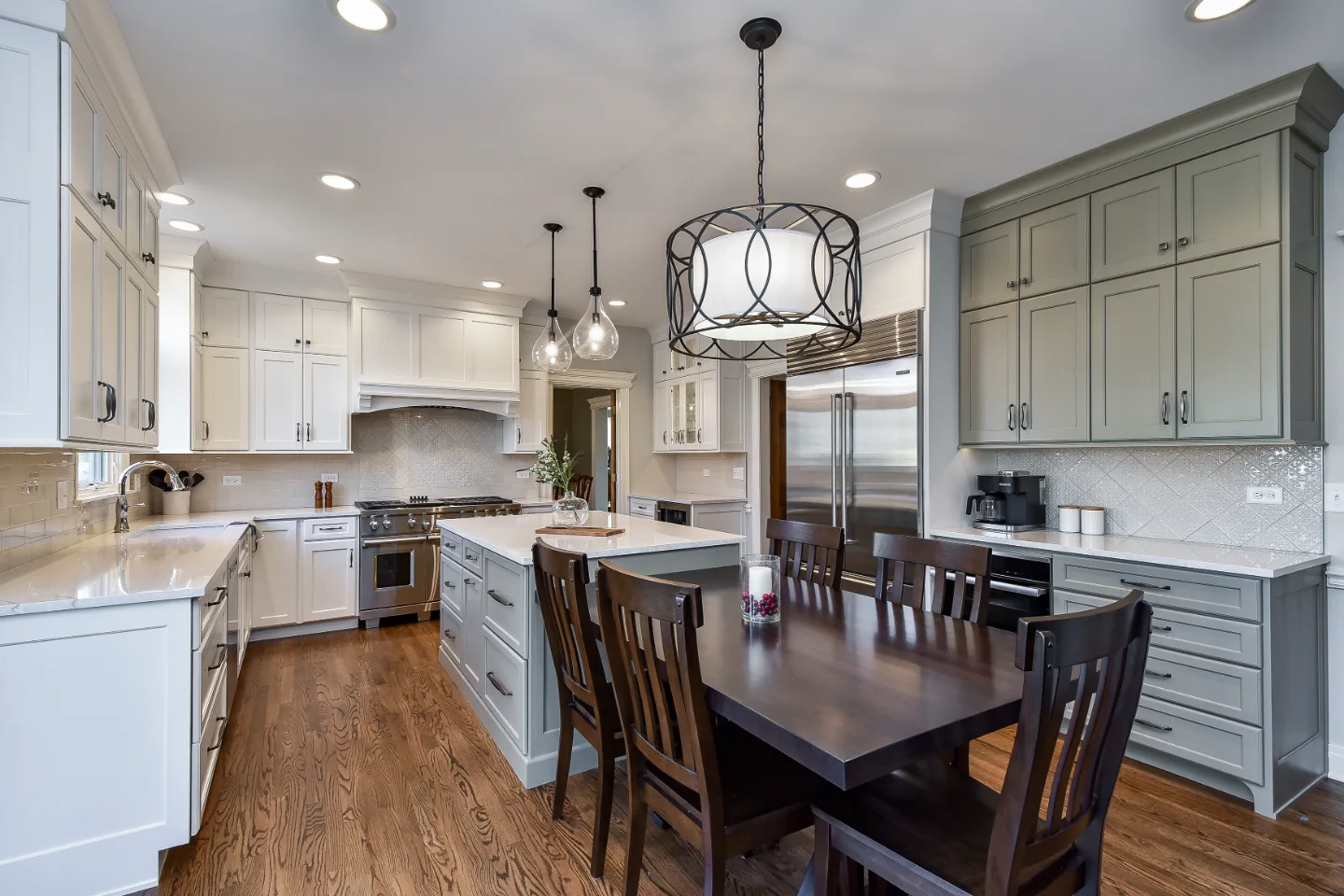 A refined-transitional kitchen remodel in Franklin, TN. CWP cabinetry in Soft White and Tarragon, Cambria Ironsbridge quartz, and Delta Cassidy Polished Nickel fixtures by Sebring Design Build.