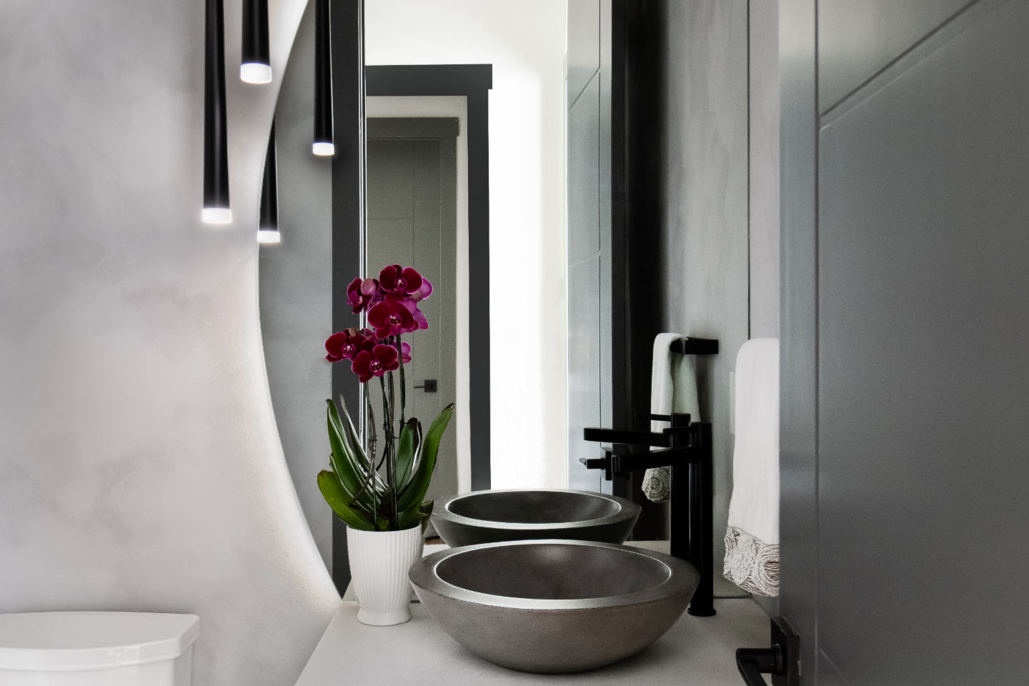 Powder Room remodel in Franklin, TN. Sebring Design Build designed this Westhaven powder room in Franklin, Tennessee with Alder Nutmeg cabinetry, Mikado Siberia White Leathered quartz, Hansgrohe Matte Black faucet.
