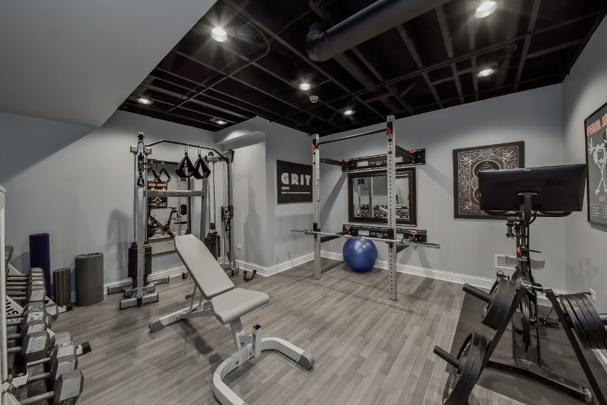 Finished basement home gym with resilient flooring