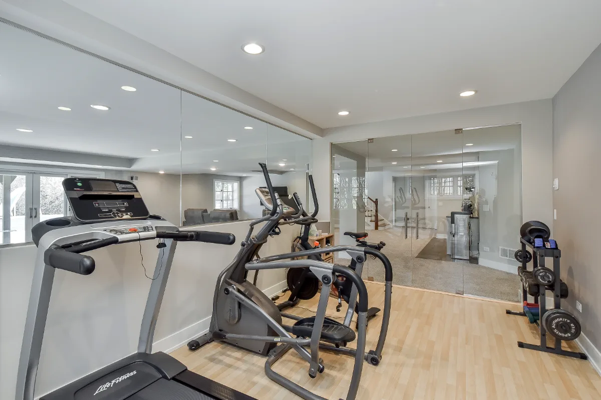 Basement remodel in Franklin, TN. Sebring Design Build finished this Franklin, Tennessee basement as a multi-zone functional-modern lower level with a main living area, gym, wet bar, guest bath, and workshop.