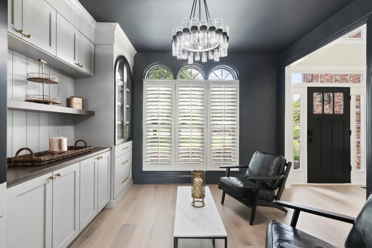Lounge remodel in Watkins Creek, TN. Sebring Design Build transformed this Watkins Creek dining room in Franklin, Tennessee with Dune and Cinder stain cabinetry accented by Bunker Hill Black, Duchateau The Guild Kayla 7.
