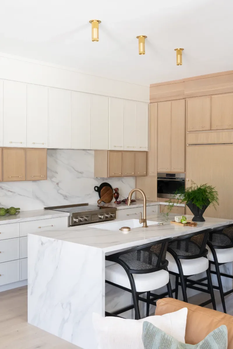 Kitchen remodel in Westhaven, TN. Sebring Design Build designed this Westhaven kitchen with Konza cabinetry in Rift White Oak with a Tatami stain, MSI Calacatta Castana quartz countertops, Art & Forge Hague hardware.