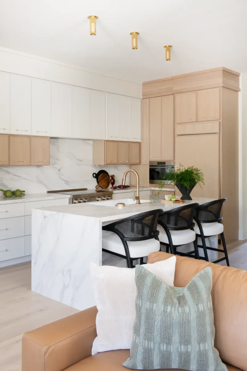 Kitchen remodel in Westhaven, TN. Sebring Design Build designed this Westhaven kitchen with Konza cabinetry in Rift White Oak with a Tatami stain, MSI Calacatta Castana quartz countertops, Art & Forge Hague hardware.