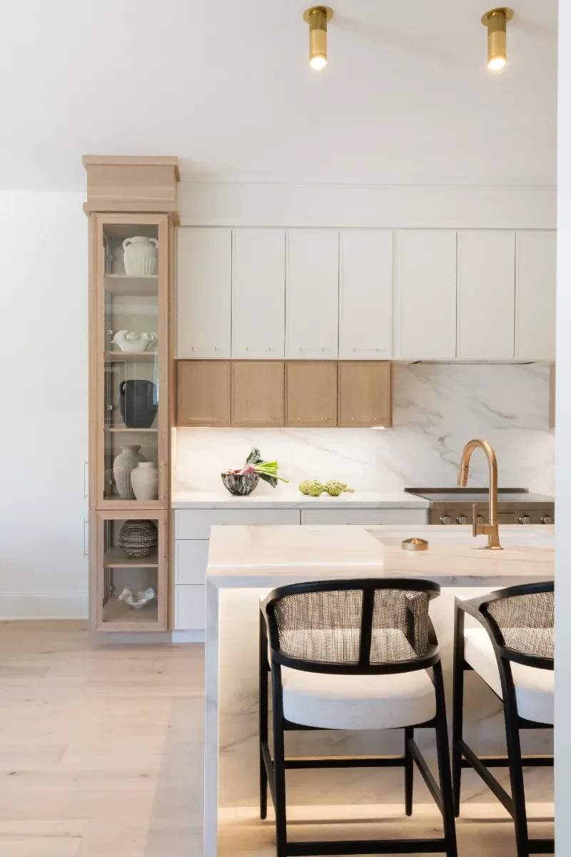 Kitchen remodel in Westhaven, TN. Sebring Design Build designed this Westhaven kitchen with Konza cabinetry in Rift White Oak with a Tatami stain, MSI Calacatta Castana quartz countertops, Art & Forge Hague hardware.