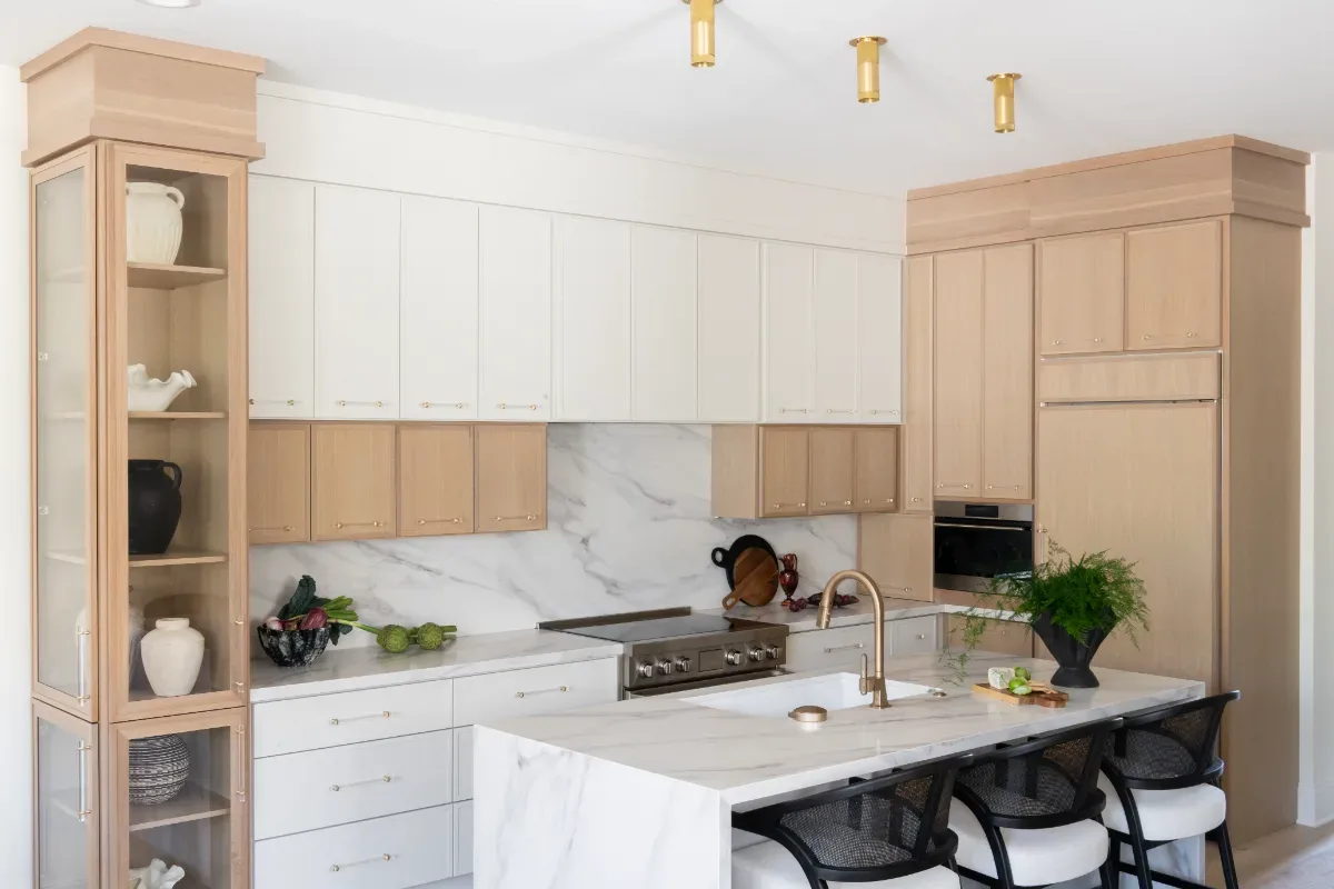 Kitchen remodel in Westhaven, TN. Sebring Design Build designed this Westhaven kitchen with Konza cabinetry in Rift White Oak with a Tatami stain, MSI Calacatta Castana quartz countertops, Art & Forge Hague hardware.
