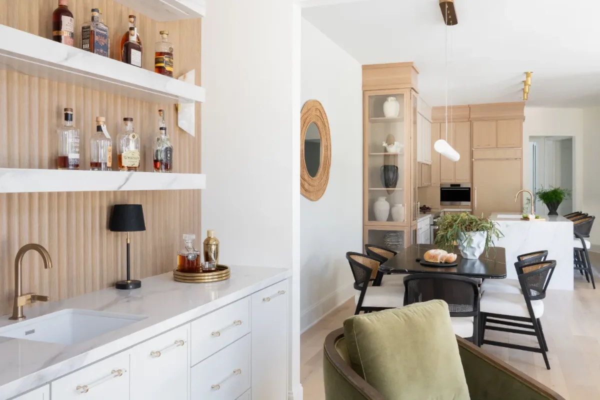 Dining Room remodel in Westhaven, TN. Sebring Design Build designed this Westhaven dining room to extend the kitchen’s minimalist palette with Rift White Oak elements, MSI Calacatta Castana quartz accents.