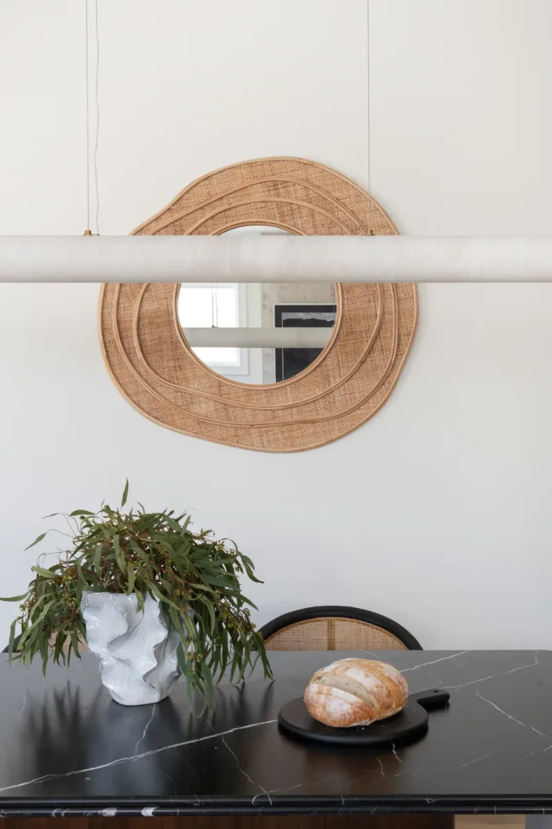 Dining Room remodel in Westhaven, TN. Sebring Design Build designed this Westhaven dining room to extend the kitchen’s minimalist palette with Rift White Oak elements, MSI Calacatta Castana quartz accents.