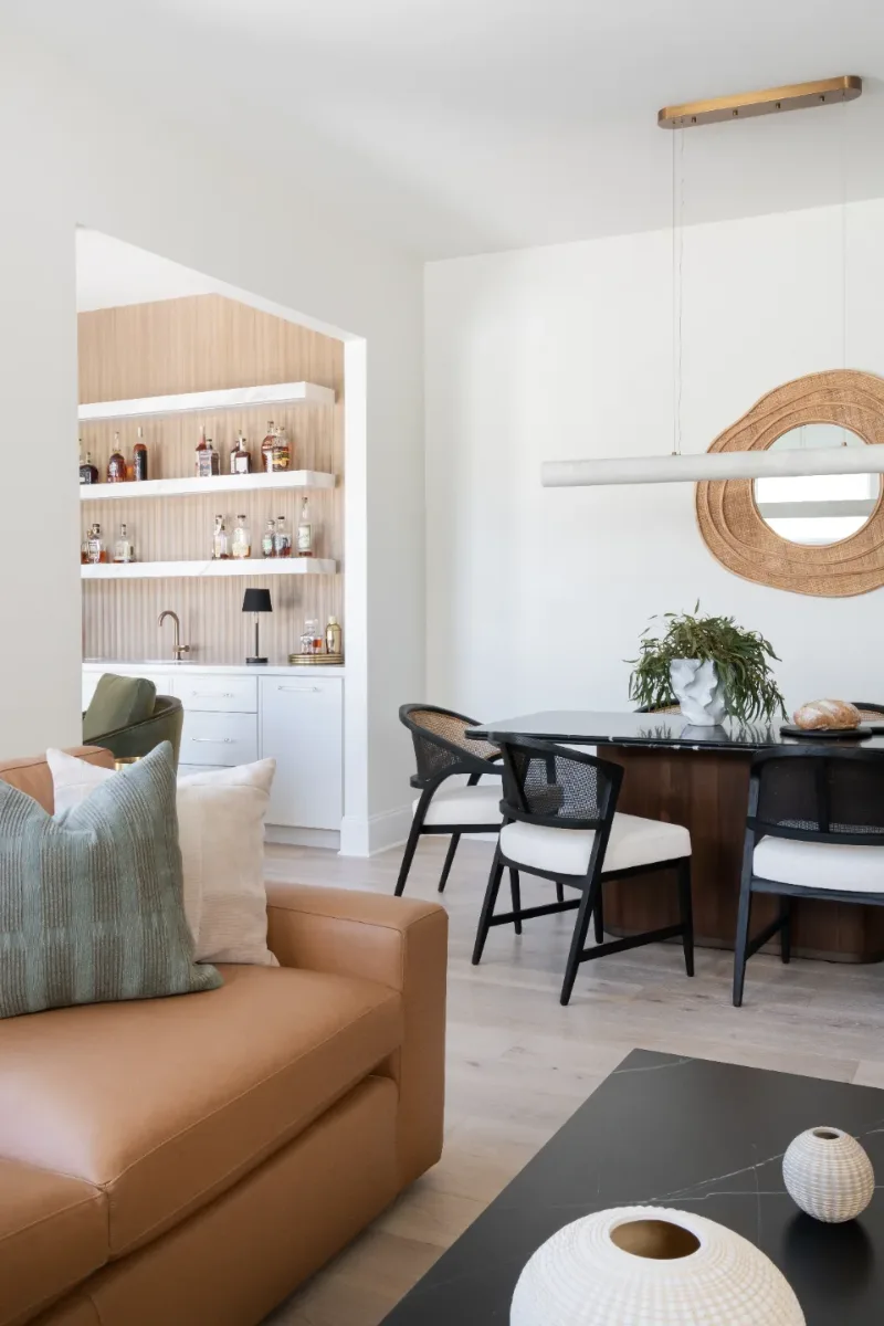 Dining Room remodel in Westhaven, TN. Sebring Design Build designed this Westhaven dining room to extend the kitchen’s minimalist palette with Rift White Oak elements, MSI Calacatta Castana quartz accents.