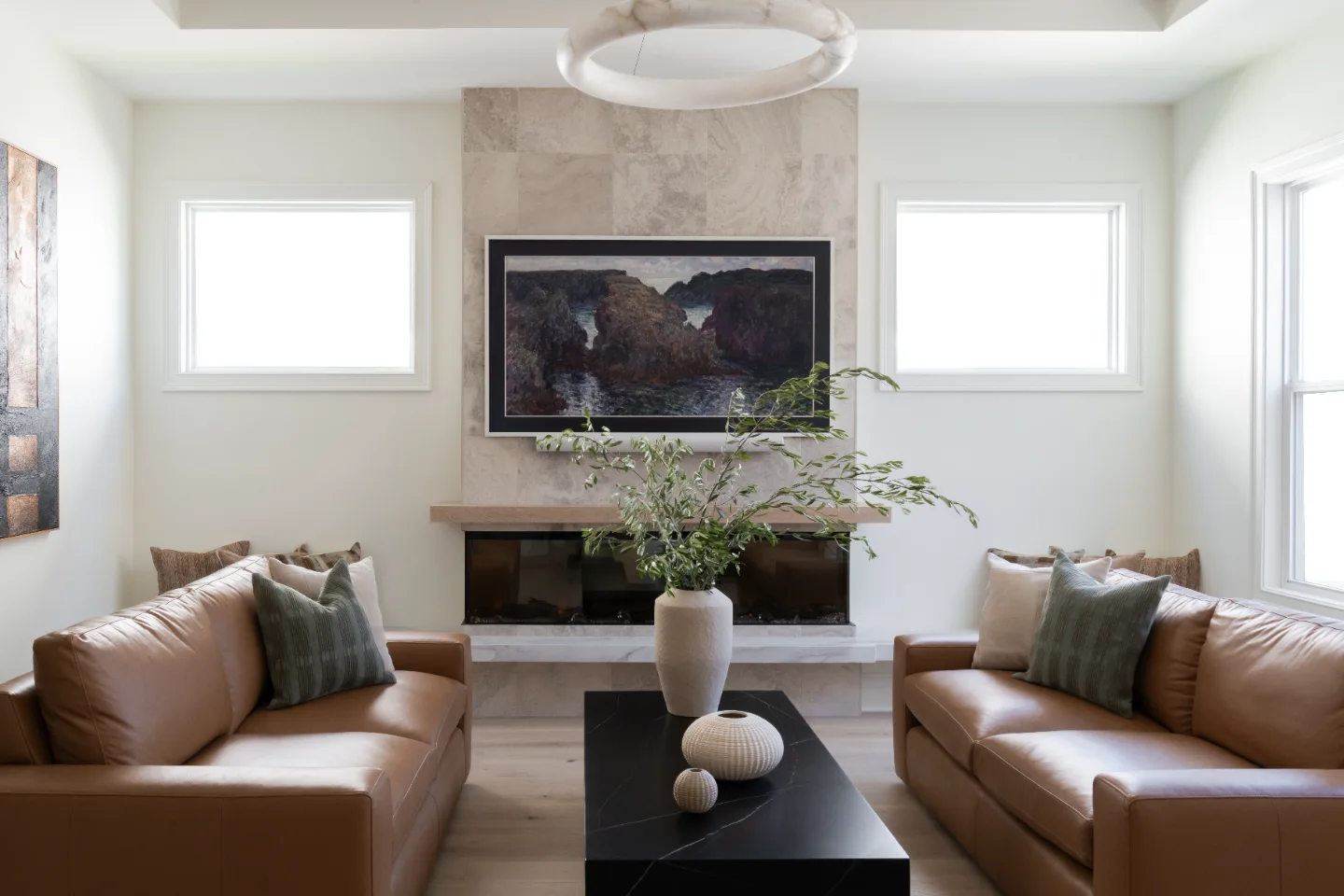 Living Room remodel in Westhaven, TN. Sebring Design Build designed this Westhaven living room to extend the kitchen’s minimalist palette with Rift White Oak elements and DuChateau Sirocco wood flooring.