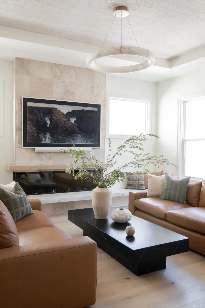 Living Room remodel in Westhaven, TN. Sebring Design Build designed this Westhaven living room to extend the kitchen’s minimalist palette with Rift White Oak elements and DuChateau Sirocco wood flooring.