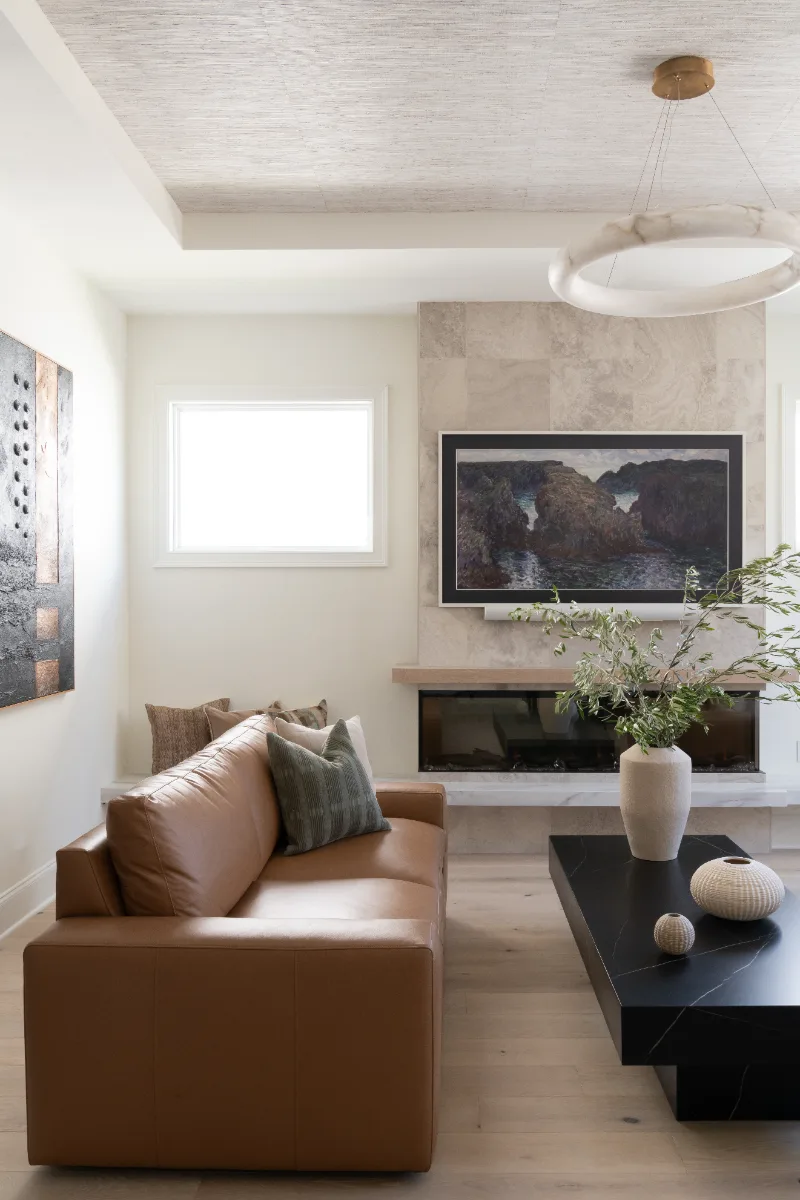 Living Room remodel in Westhaven, TN. Sebring Design Build designed this Westhaven living room to extend the kitchen’s minimalist palette with Rift White Oak elements and DuChateau Sirocco wood flooring.