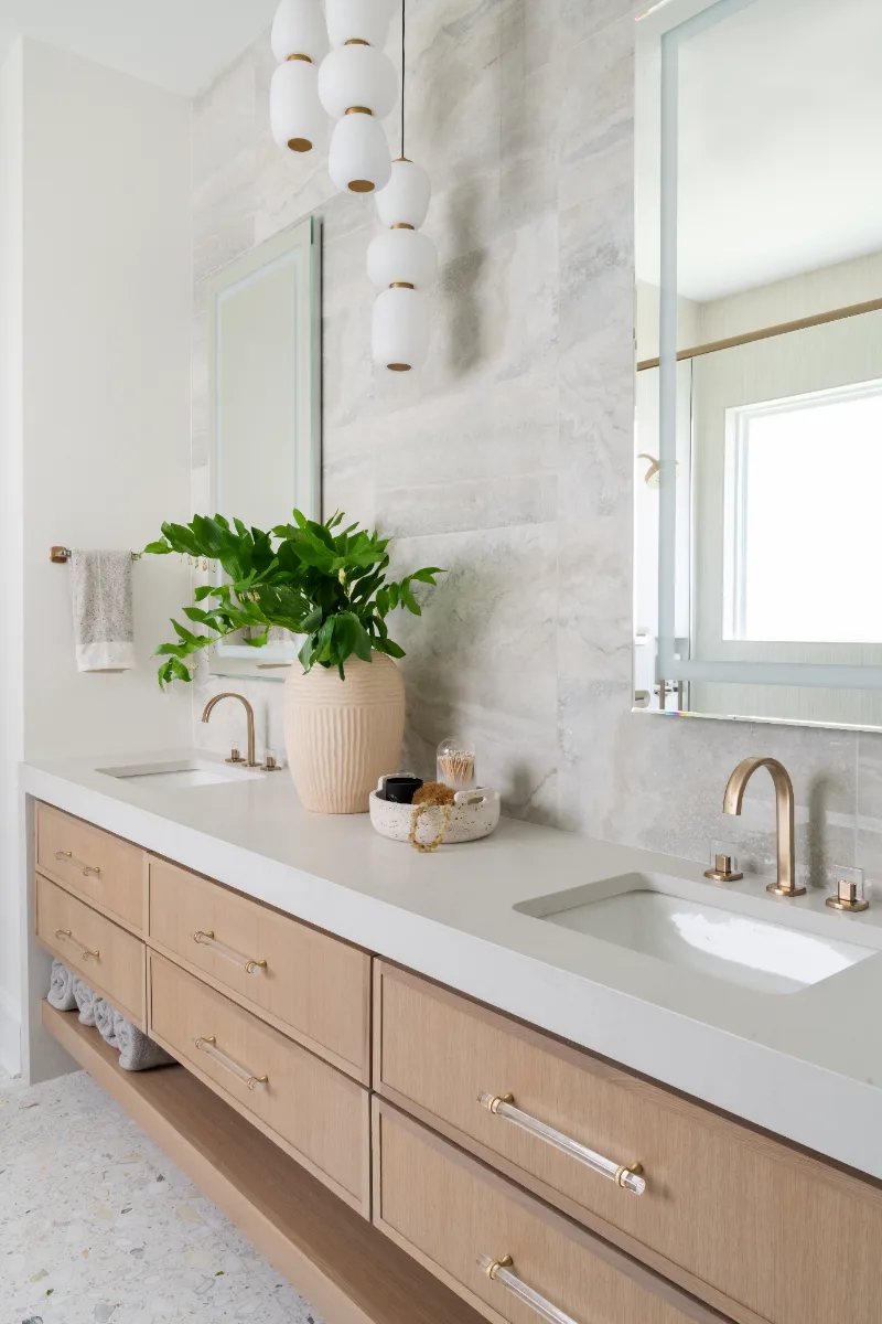 Primary Bath remodel in Westhaven, TN. Sebring Design Build designed this Westhaven primary bath to extend the home’s minimalist palette with Rift White Oak elements and MSI Calacatta Castana quartz.