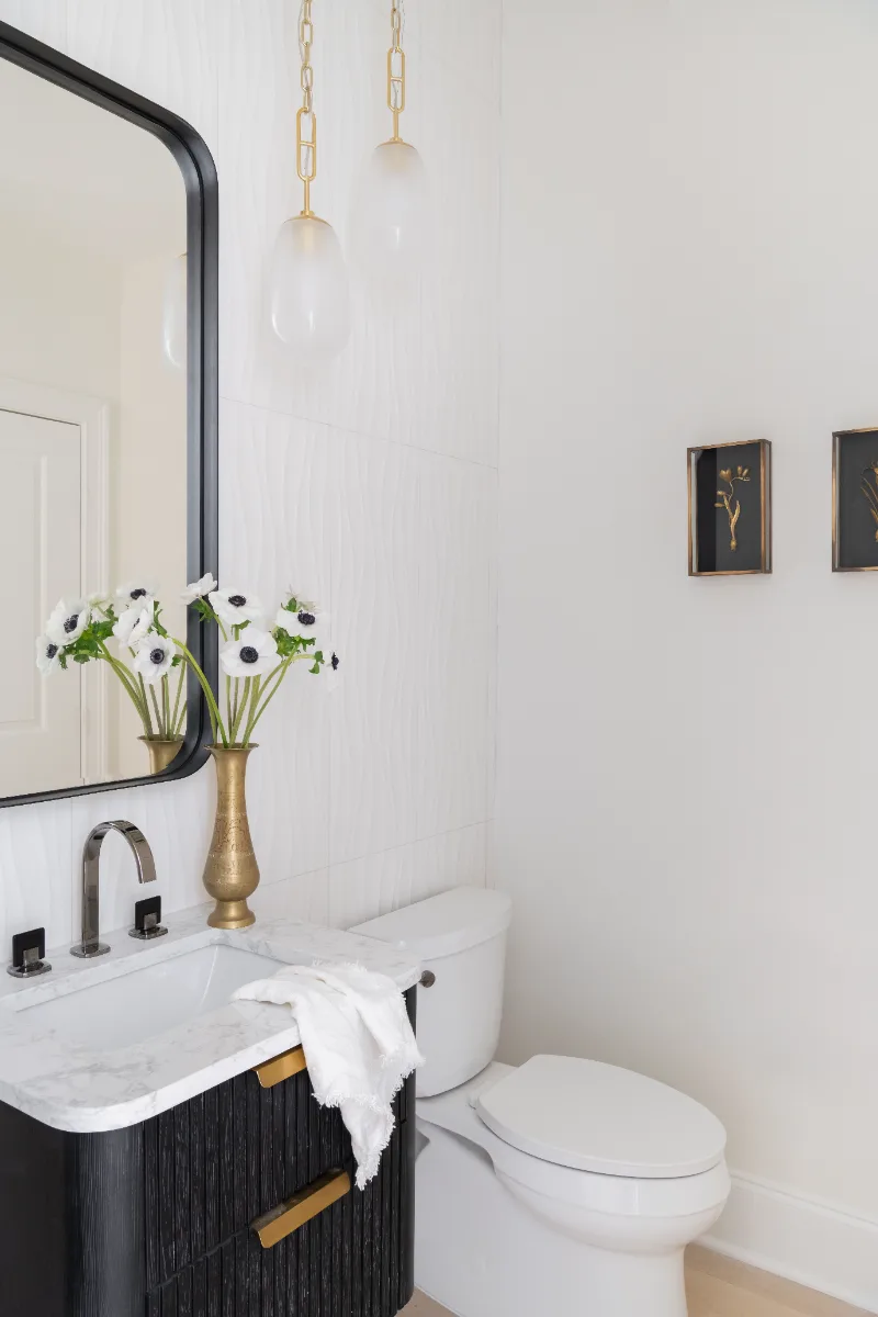 Guest Bath remodel in Westhaven, TN. Sebring Design Build designed this Westhaven guest bath, featuring MSI Calacatta Castana quartz, Rift White Oak cabinetry elements, and specified tile finishes.