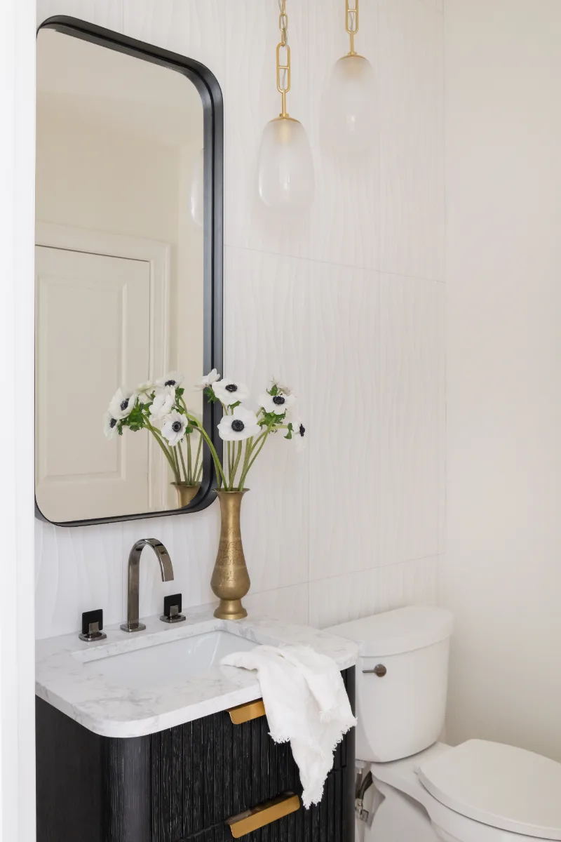 Guest Bath remodel in Westhaven, TN. Sebring Design Build designed this Westhaven guest bath, featuring MSI Calacatta Castana quartz, Rift White Oak cabinetry elements, and specified tile finishes.