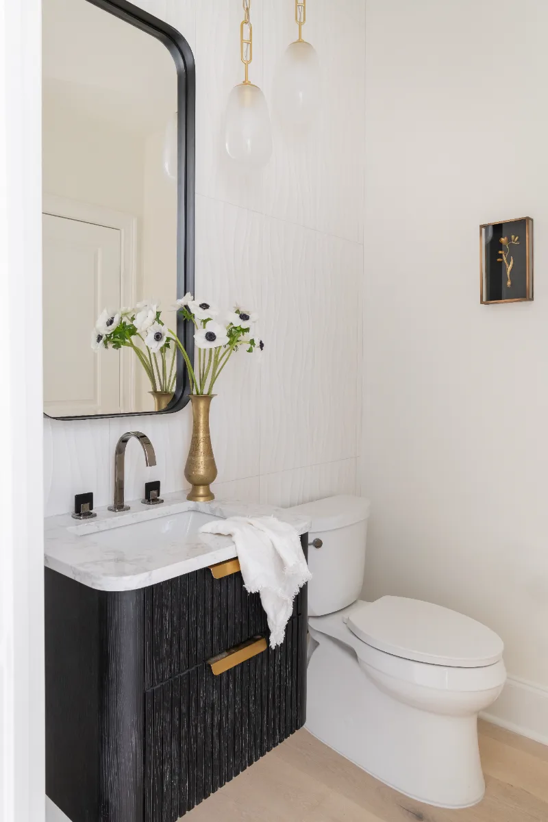 Guest Bath remodel in Westhaven, TN. Sebring Design Build designed this Westhaven guest bath, featuring MSI Calacatta Castana quartz, Rift White Oak cabinetry elements, and specified tile finishes.