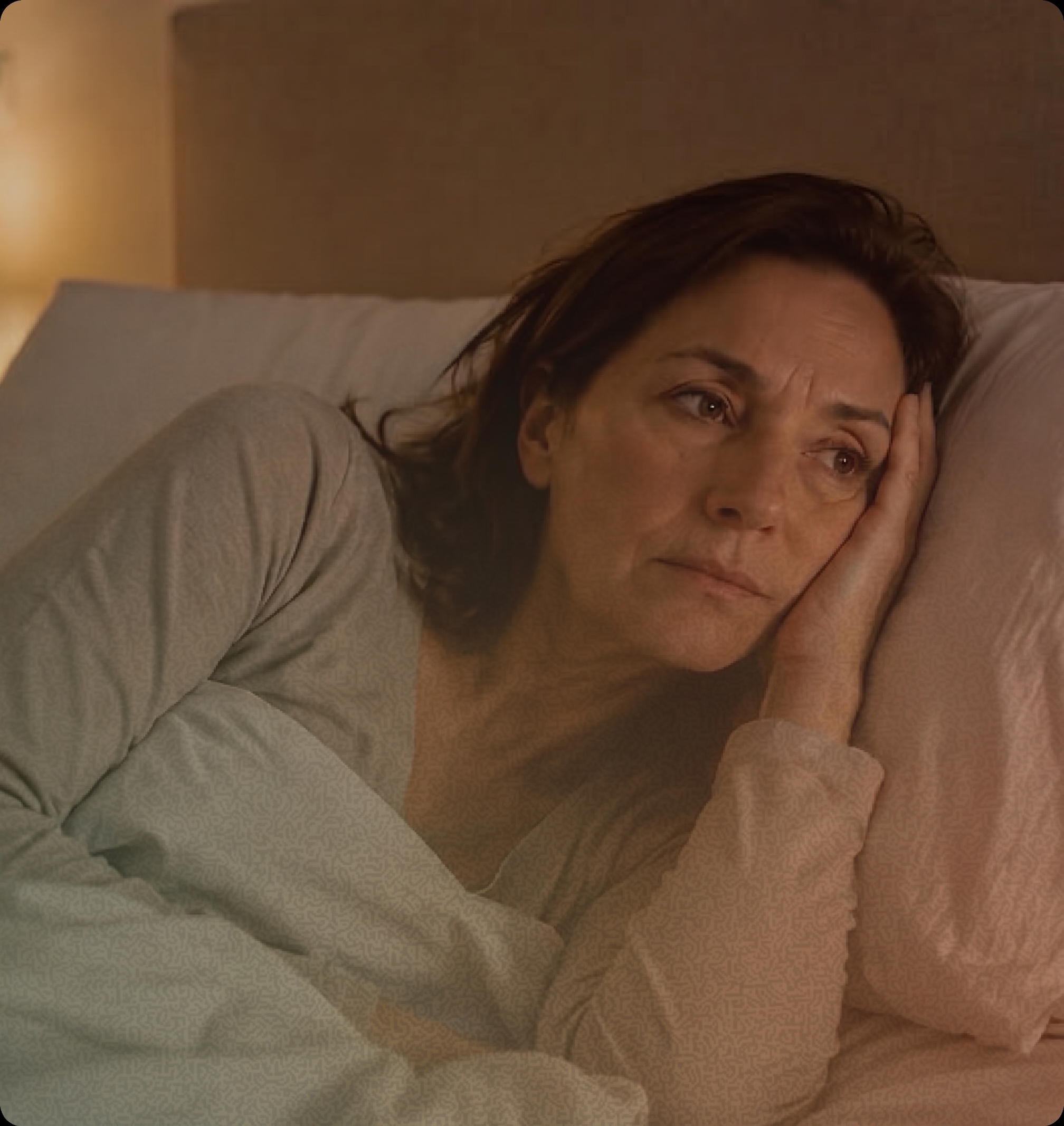 A woman lying down, thinking