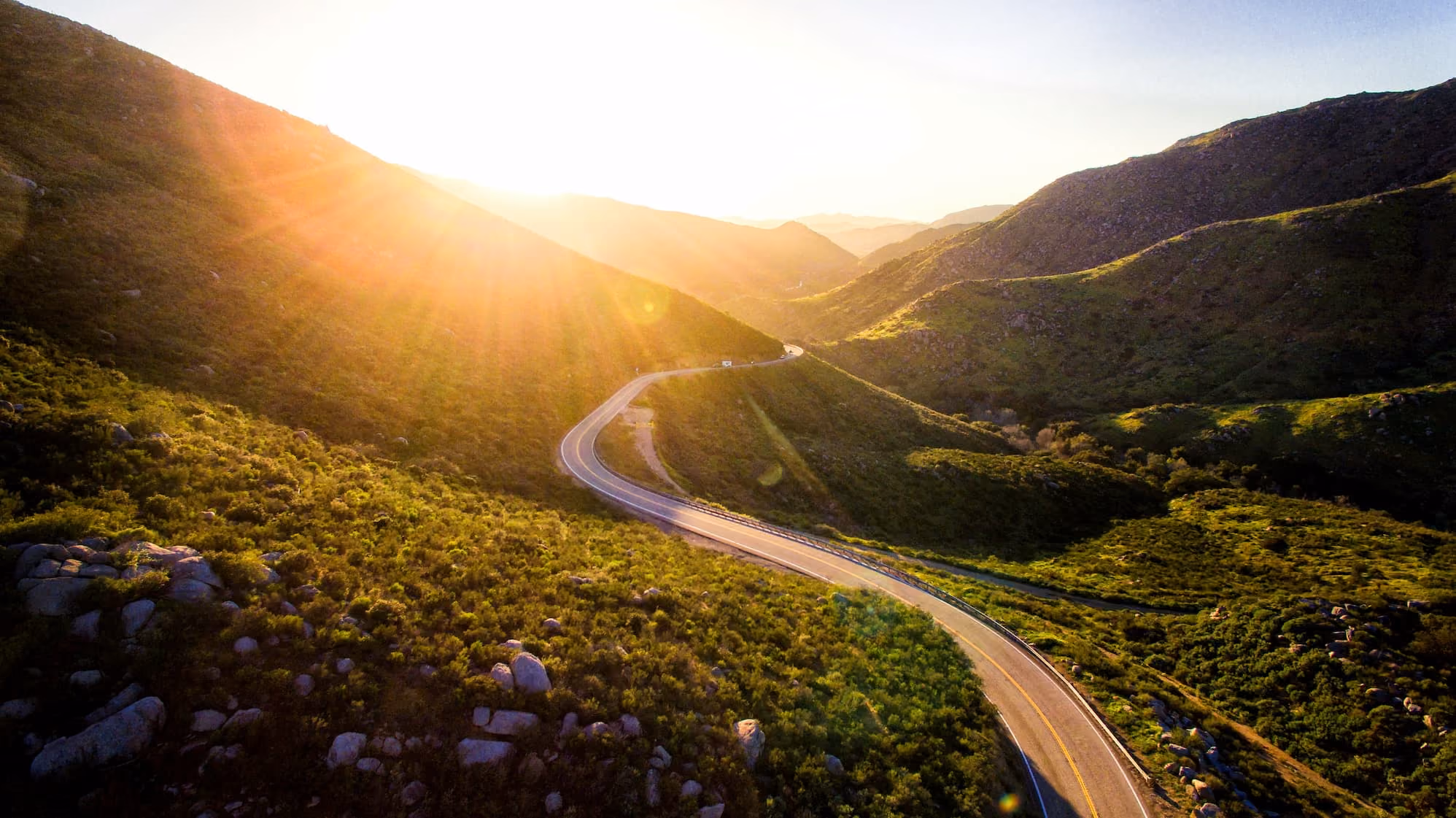 Winding road in the mountains in the morning sun.