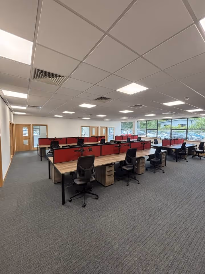 The new office installation at Alfred Knights head office showing rows of desks and chair for staff.