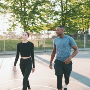 woman and man walking outside