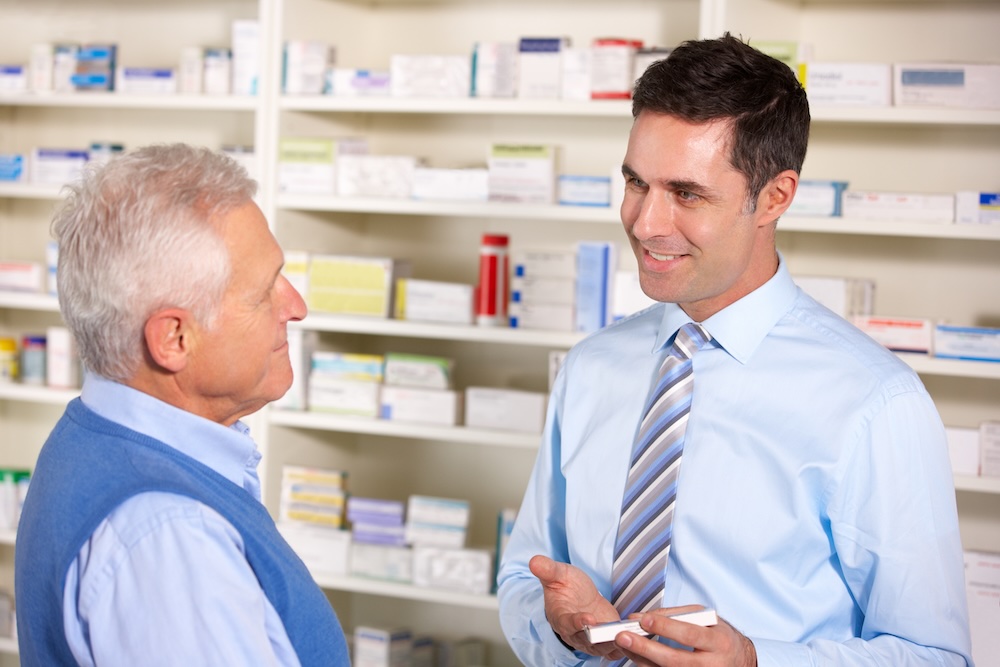 Patient in pharmacy with pharmacist