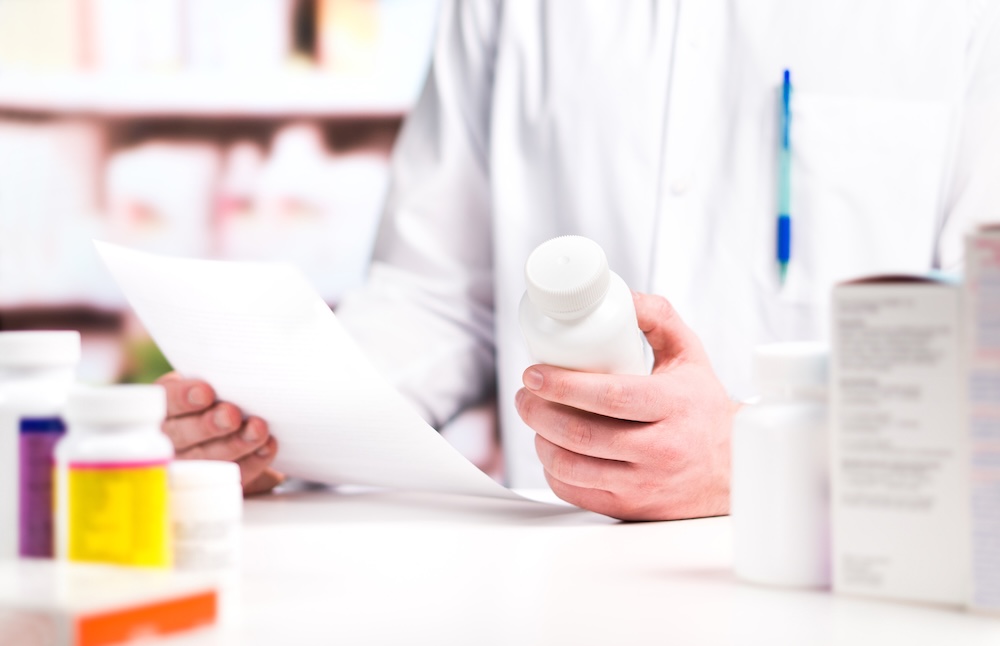 Pharmacist inspecting prescription