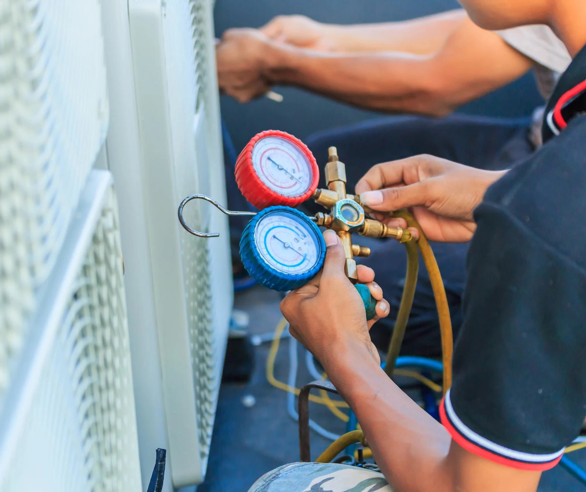 Repairman fixing Air Conditioning