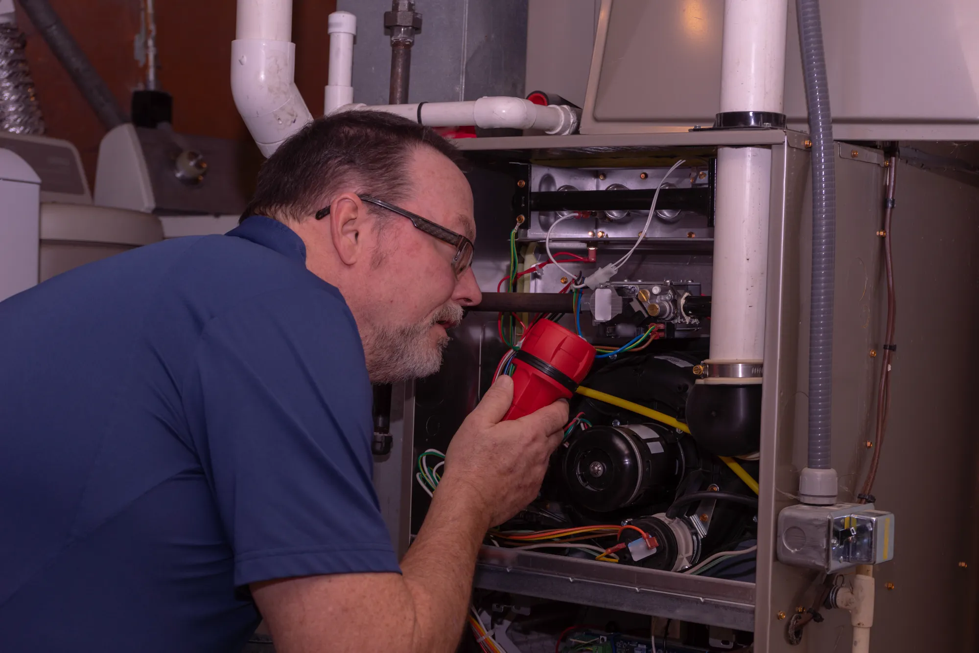 Repairman fixing heating