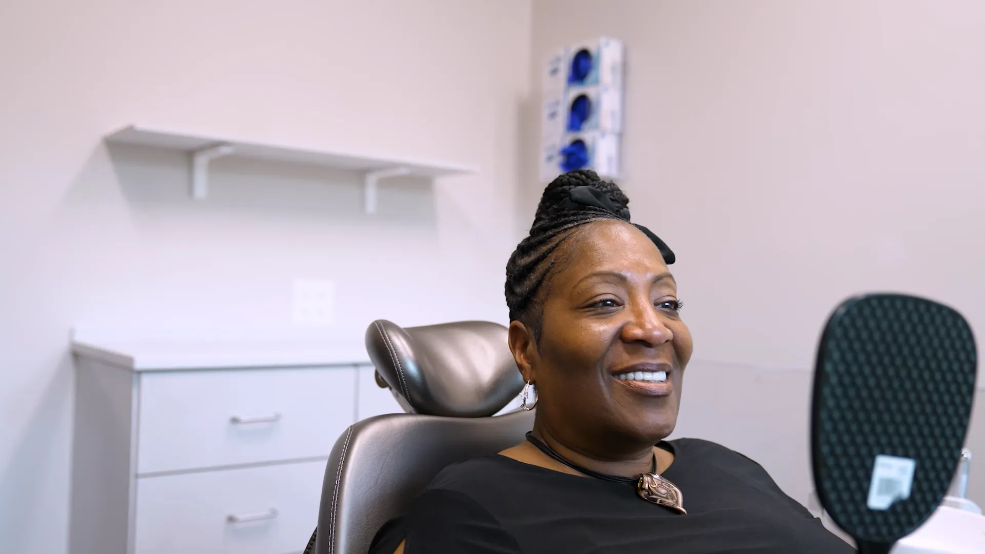 Smiling woman in a dental chair